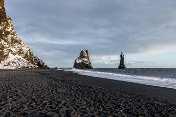 Sea stacks at Reynisfjara black sand beach Iceland.