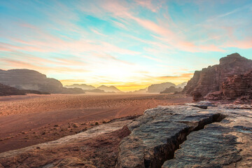 Rock formations and desert valley at sunrise in the Wadi Rum region, southern Jordan