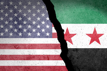 Flag of USA and Syria painted on a concrete wall