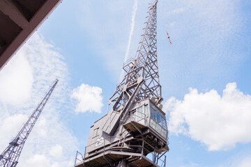Bristol UK: 28th July 2025: Visitors can explore the M Shed museum in Bristol, observing historic cranes that tell the story of the city's maritime heritage