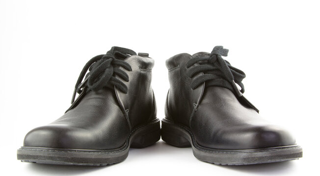 A pair of black leather shoes isolated on white