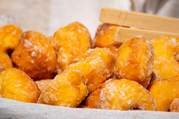 Traditional fried dough pastries with sugar glaze. The Concept of sweet indulgence.