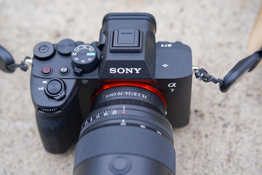 Close-up of brand new Sony Alpha 7 V photo camera with Sony G-Master 14-70 mm II photo lens outdoors at terrace on a foggy autumn day. Photo taken December 13th, 2025, Zurich, Switzerland.