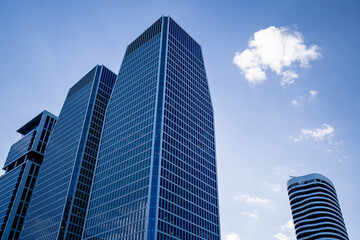 Fototapeta premium Futuristic buildings against a blue sky, Tel Aviv, Israel. Modern Middle Eastern city.