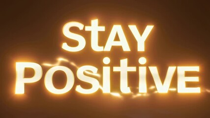 Glowing inspirational message stay positive in bright white text against a dark warm background for motivation