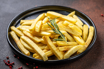 Golden crispy french fries with rosemary