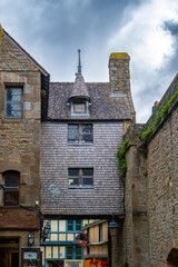 The Mont-Saint-Michel Abbey is an abbey located within the city and island of Mont-Saint-Michel in Normandy, in the department of Manche. The abbey is an essential part of the structural composition o