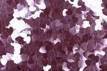 Holographic glitter background in violet tone, texture in stylish Christmas view.