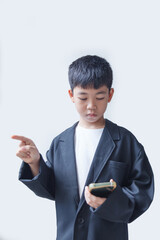 Young asian boy using mobile phone isolated on a white background.
