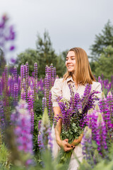 Natural lifestyle portrait of woman in blooming flower field