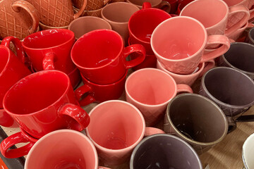 Lots of colorful cups for sale in the store