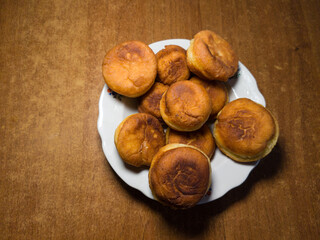 Golden Buns on White Plate - Warm Homemade Pastries