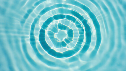 Blue swirling water ripple vortex texture and light pattern abstract design