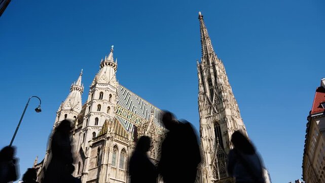 Vienna St. Stephen's Cathedral (Stephansdom). Roman Catholic Archdiocese of Vienna. People walking on The Stephansplatz square, Austria city