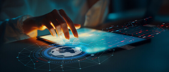 Futuristic Technology Concept with Person Using Tablet and Digital Globe Displaying Data Visualization and Innovative Interface in Dark Environment