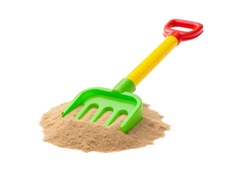 Colorful beach sand rake toy with red handle in sand, isolated on a transparent background