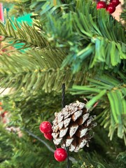 Season's greetings scene. Top view of Christmas decorations, balls, rustic star, holly berries,...