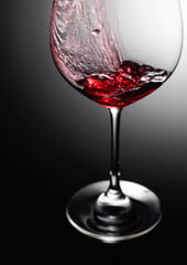 Closeup of red wine pouring.