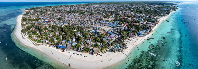 panoramic aerial landscape view of Nungwi, a large village located in the far northern end of island of Zanzibar, a popular tourist destination with one of the best beaches in the world 