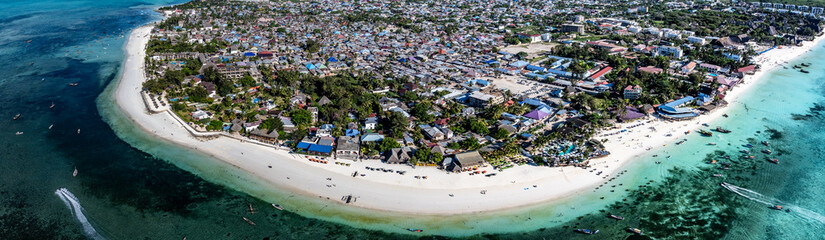 wide angle  aerial landscape view of Nungwi, a large village located in the far northern end of island of Zanzibar, a popular tourist destination with one of the best beaches in the world 