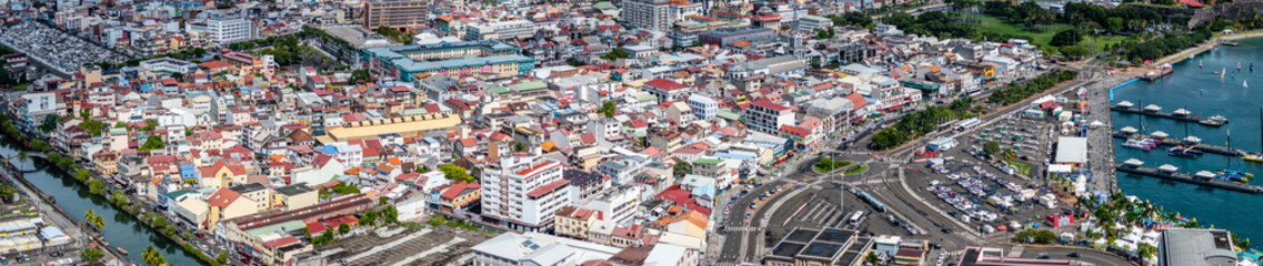 panoramic aerial view of central part of Fort-de-France, with Malecon, harbor and Old town as well es La Savane Park in background, situated in Martinique, Lesser Antilles, Caribbean