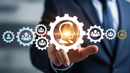 Businessman interacting with glowing gear icons representing teamwork and network connection in a professional setting with technology