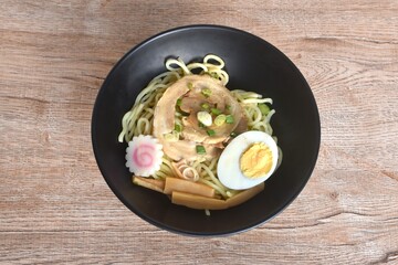 Tonkotsu Chashu ramen orJapanese yellow noodles topping slice braised pork with boiled egg in Miso soy sauce on bowl