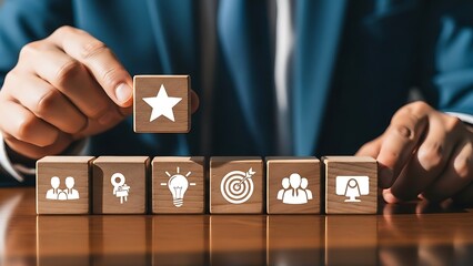 Businessman placing a star rating block on a row of wooden blocks with various business and strategy icons