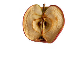 Shriveled apple cut in half isolated on a transparent background fruit