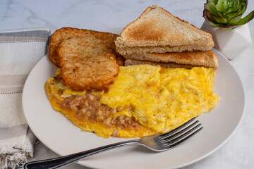 corn beef hash omelette withtoast and hash browns