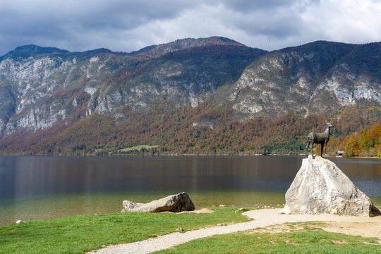 Scenic View of Lake Bohinj Featuring the Zlatorog Mythical Ibex Statue in Slovenia