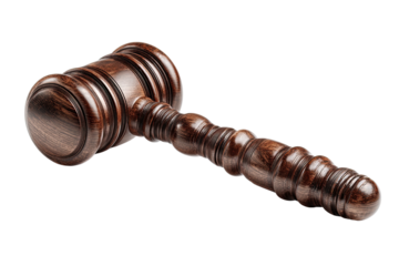 A close-up shot of a finely crafted wooden gavel against a solid black background