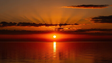 Dramatic Ocean Sunset with Reflections and Stunning Light Rays