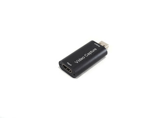 A cheap HDMI video capture card for recording and live streaming, isolated on a white background.

