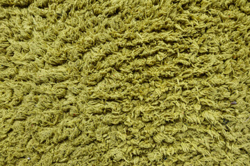 Green fabric texture background with rough woven fibers and detailed surface pattern, suitable for textile, material, abstract, and background design use.