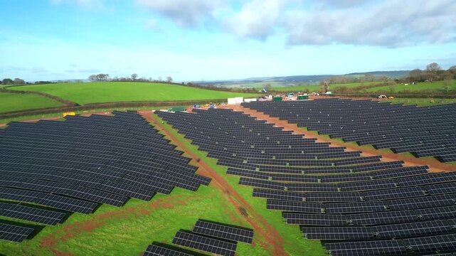 Coffinswell, South Devon, England: DRONE VIEWS: A solar panel farm surrounded by open countryside and farmland. Solar power is an integral part of the UK government's strategy for achieving net zero.