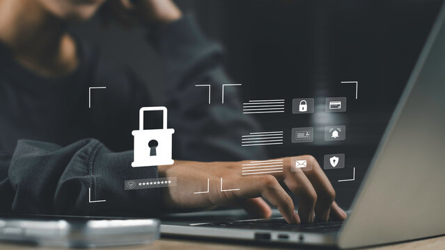 Cybersecurity concept with access control and password protection. A hand typing on laptop with lock icon and digital security interface.