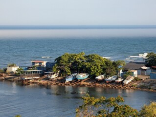 A fishing pier juts out into the sea, a view of the sea on a clear day