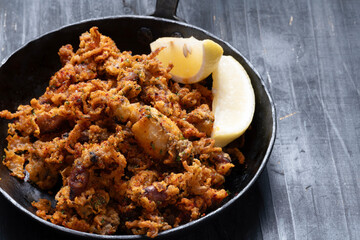 pan of crispy fried baby calamari side dish