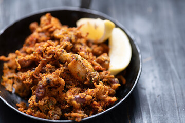 pan of crispy fried baby calamari side dish