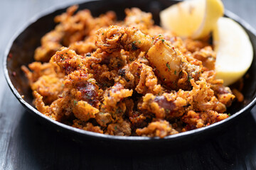pan of crispy fried baby calamari side dish