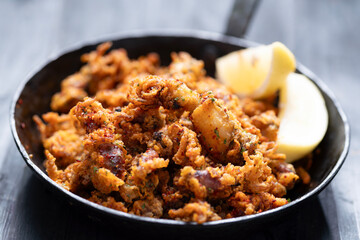 pan of crispy fried baby calamari side dish
