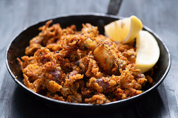 pan of crispy fried baby calamari side dish