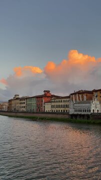 Italy Pisa city and Arno river fiume in sunset, vertical video.