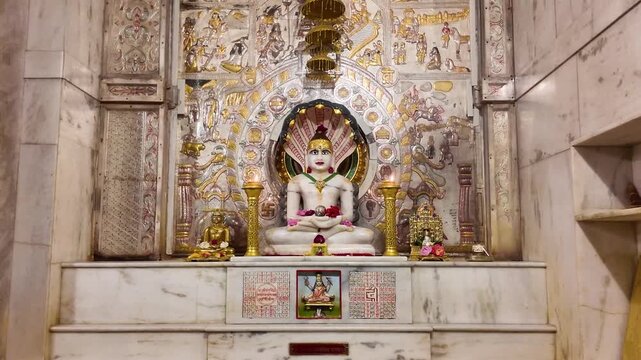 Interior of Jain Mandir with Intricate Karigari &ndash; Beautifully Carved Pillars, Sacred Tirthankar Idols, and Traditional Indian Temple Architecture Showcasing Spiritual Art and Cultural Heritage