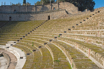 Interior of ancient Roman amphitheater with rows of seating