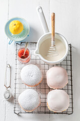 Homemade and hot donuts with red jam