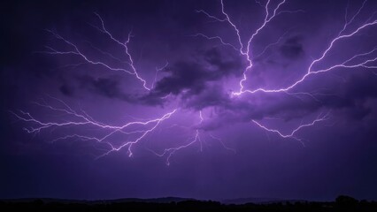 Vibrant Purple Lightning Strikes Through Dark Storm Clouds Illuminating the Night Sky Over a Silhouetted Landscape