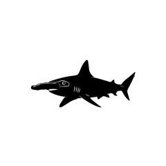 Obraz premium A black silhouette of a hammerhead shark swimming in profile, isolated on a white background.