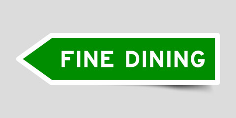 Green color arrow shape sticker label with word fine dining on gray background